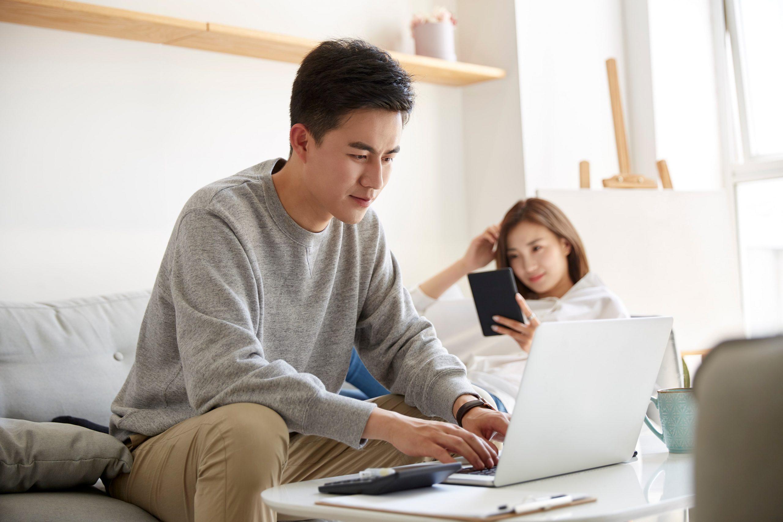 Man reviewing paperwork at home